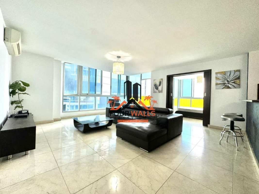Master bedroom with ocean view window and modern furnishings in Bella Vista Panama City