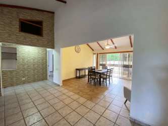 Dining space with vaulted ceiling, open concept next to living room in Coronado beach villa Panama