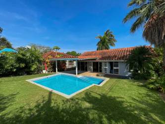 Bright living room with vaulted ceiling, wood beams, natural light, Club Ecuestre Coronado Panama