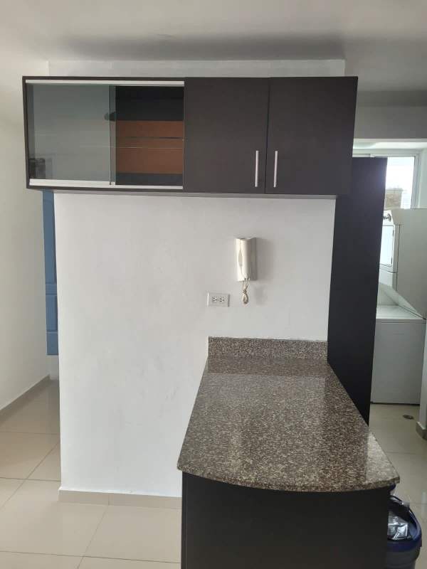 Open kitchen with cabinets, granite countertop, porcelain floor in PH City Tower near 12 de Octubre Panama