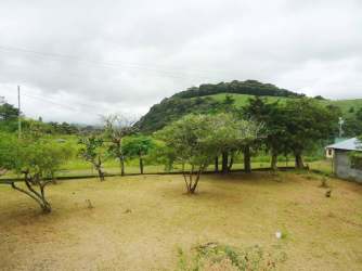 Spacious fenced yard with countryside and mountain backdrop in Paso Ancho Tierras Altas