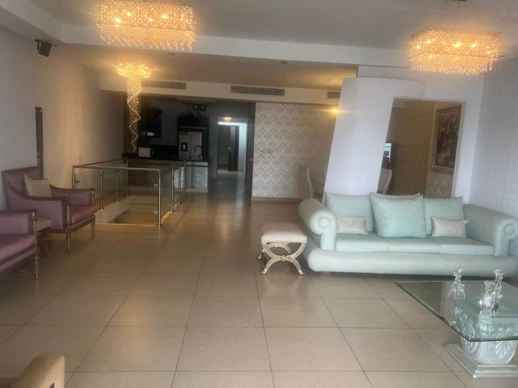 Luxurious master bedroom with marble floors and ocean view balcony at Penthouse Rivage Panama City