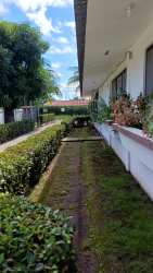 Exterior landscaped garden path with planter boxes in house for rent San Antonio David Panama
