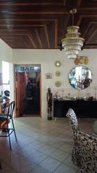 Eclectic rustic living dining room with wood ceilings in spacious David Panama rental house