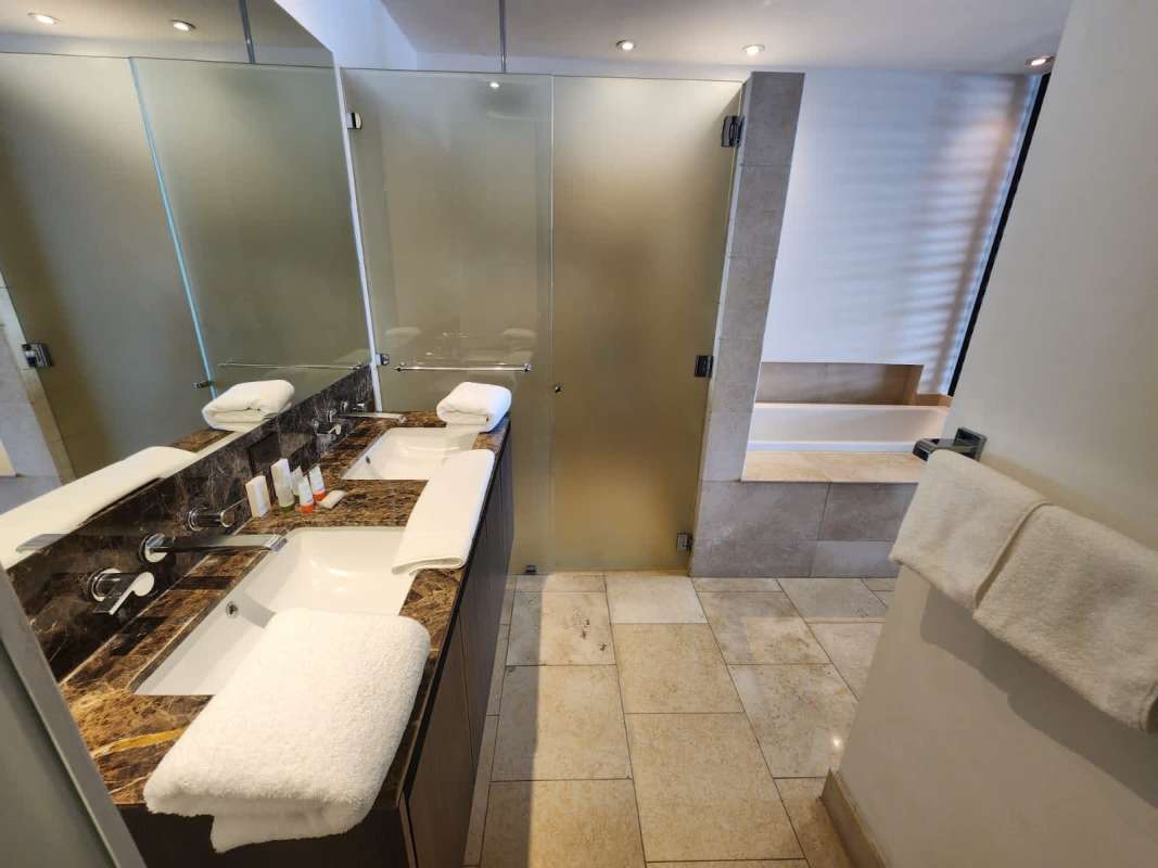 Modern bathroom with marble countertop double vanity luxury rental JW Marriott Panama Punta Pacifica