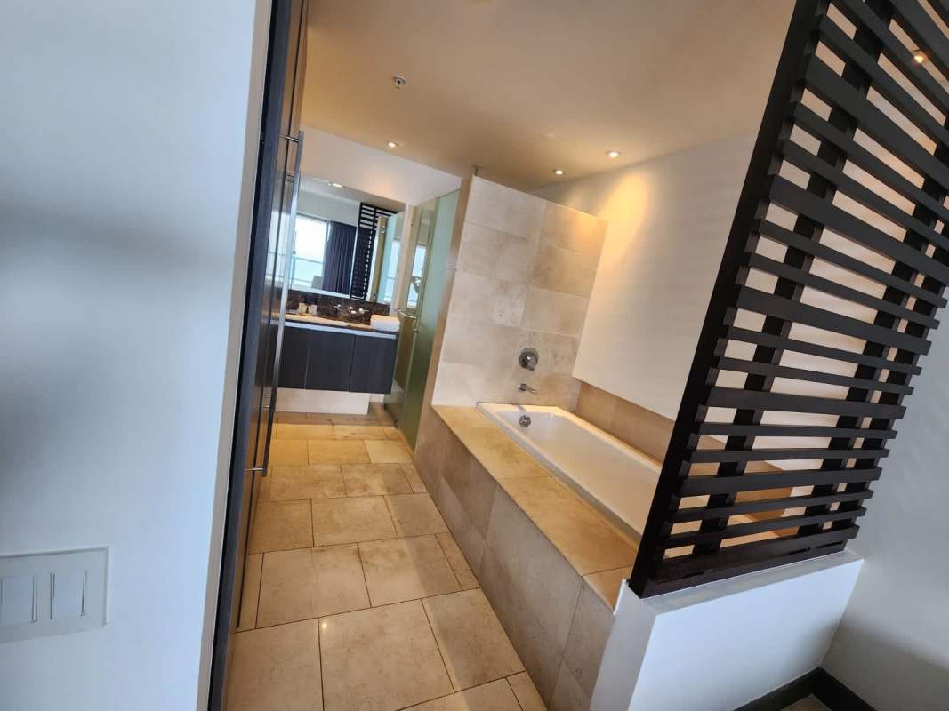 Bedroom with sliding doors to balcony and Pacific ocean views luxury PH JW Marriott Panama apartment rental