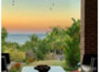 Dining interior with large windows, sunset ocean view San Carlos Panama