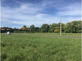 Vacant grassy parcel with utility access in Sol y Mar Panama beachfront property for sale