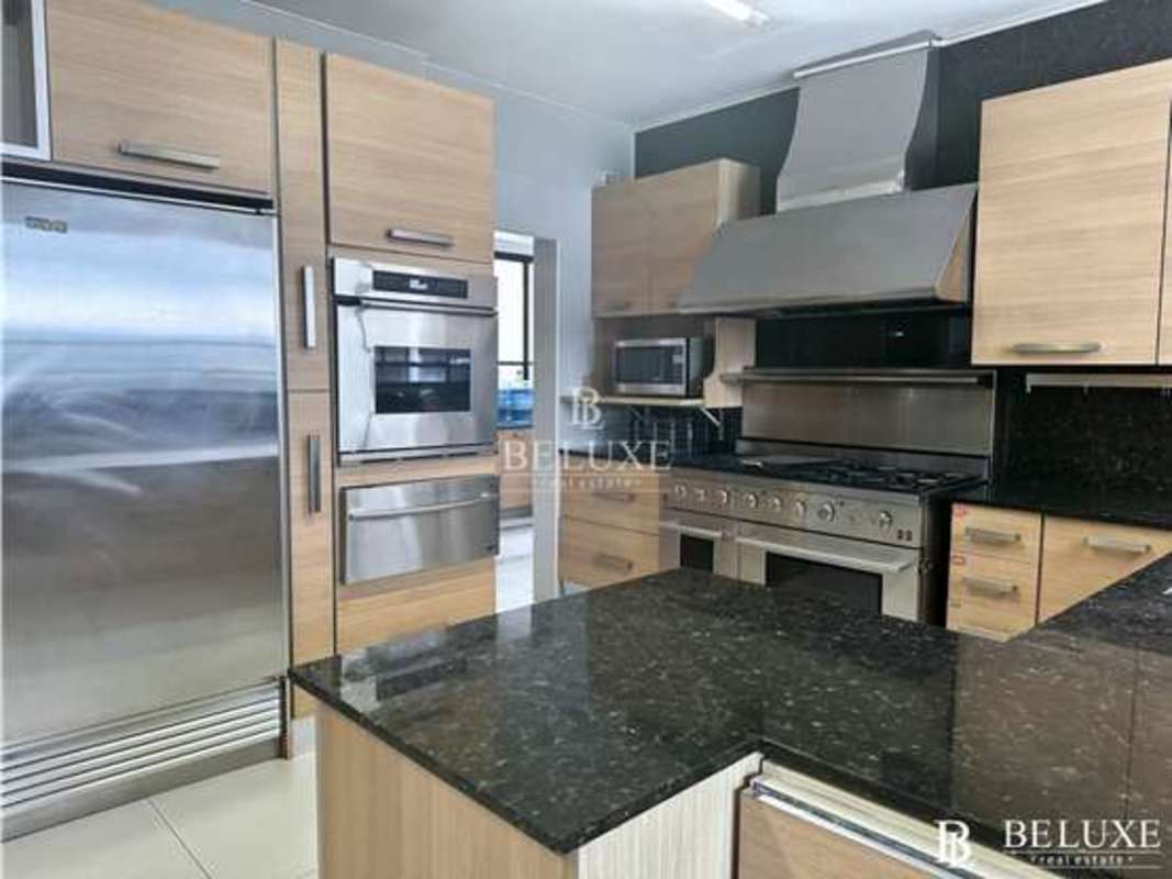 Modern kitchen with premium stainless appliances, granite surfaces in PH Regent Penthouse Panama