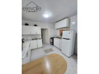 Mediterranean-style pool with patio, covered terrace and garden at Coronado beach house.