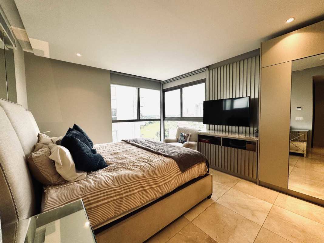 Bedroom with floor-to-ceiling windows, upholstered bed, mirrored closet PH Vitta Santa Maria Panama