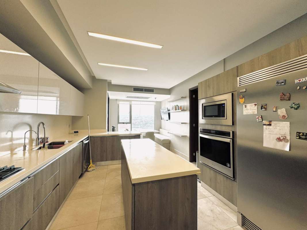 Modern nursery with built-in wardrobe, pendant lights, wood panel walls in PH Vitta Santa Maria Panama