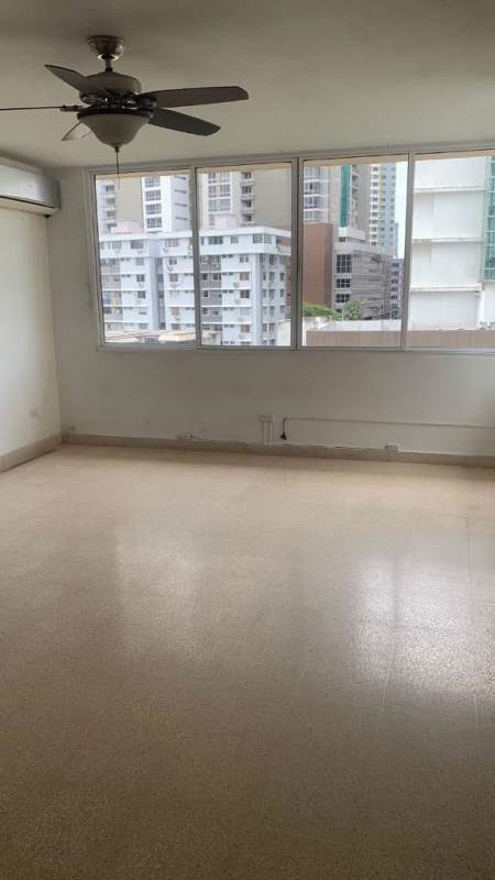 Living room with large window balcony door and tiled floors apartment for sale Panama
