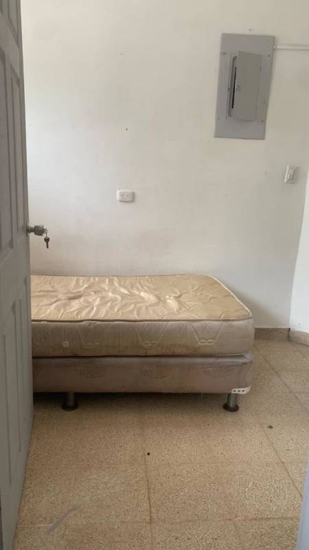 Basic bedroom with tile floors and window in apartment for sale PH Vía Argentina Panama