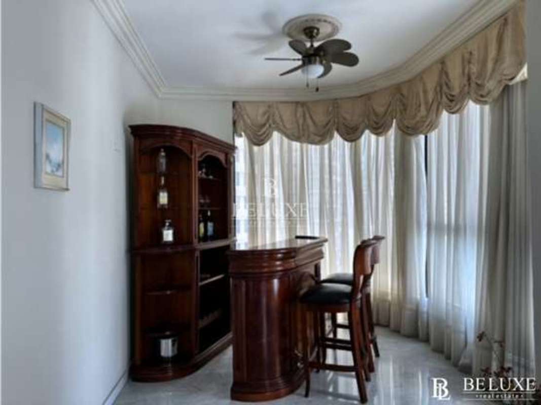 Spacious living room with floor-to-ceiling windows and panoramic ocean views in PH Regent Punta Paitilla Panama