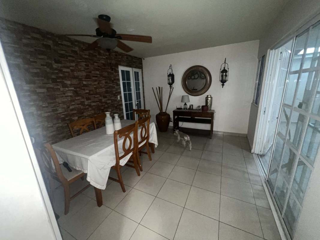 Dining room with glass door to terrace at house Villa Serena Panama