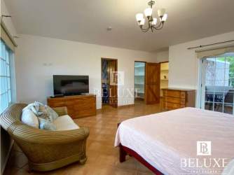 Large living room with seating chandelier tiled floors at beach villa Coronado Panama