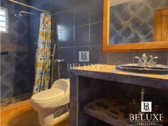 Covered terrace overlooking private swimming pool, tropical garden in Costa Coronado beach villa