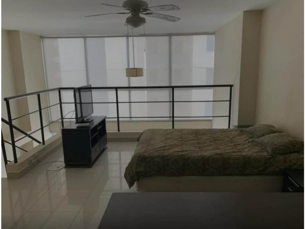 Open kitchen with granite counter and dining space at PH Vitro Panama