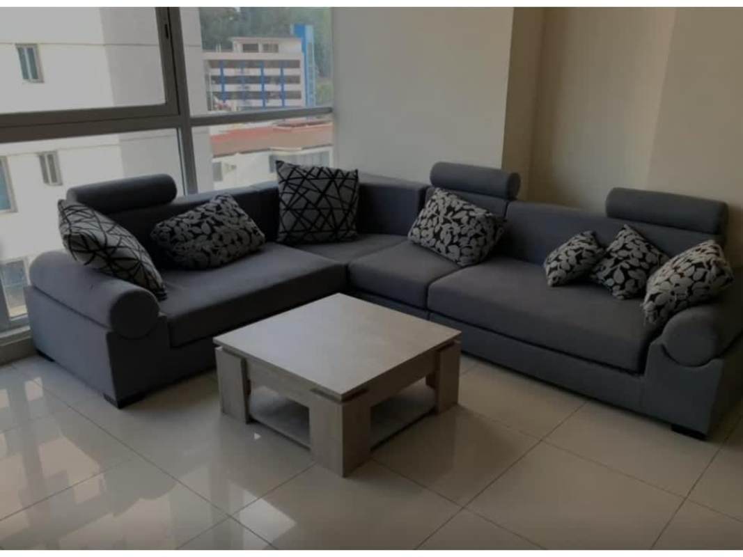 Loft bedroom featuring ceiling fan, large windows and TV in PH Vitro Panama City