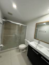 Cozy bedroom with built-in closet and garden views PH Midrise Woodlands Panama Pacifico