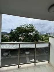 Modern bathroom with glass-enclosed shower, vanity and porcelain tile PH Midrise Panama Pacifico