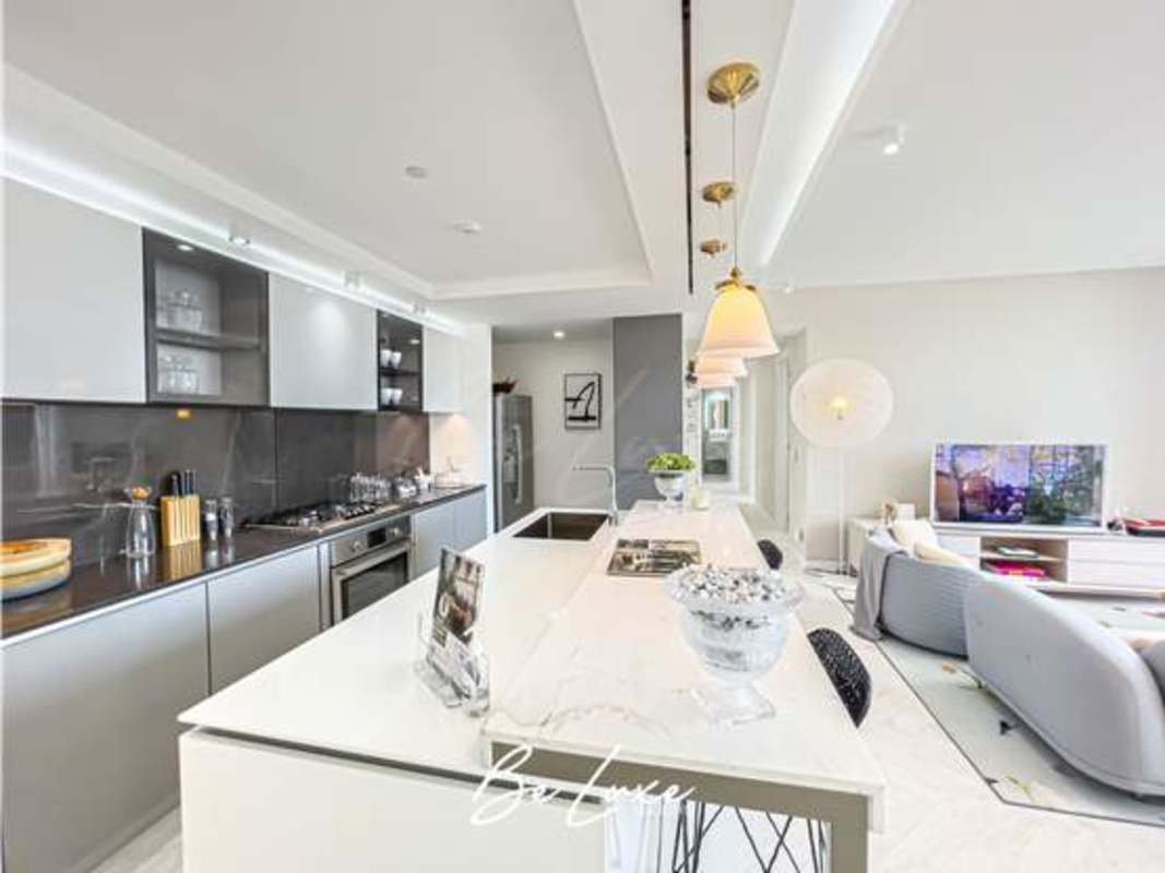 Bright luxury apartment open kitchen with living area and view in PH Wanders & Yoo Panama City