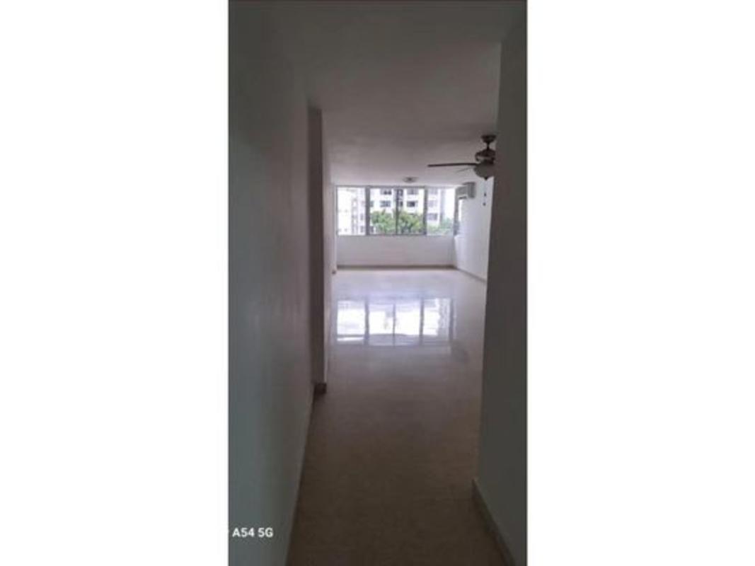 Spacious living and dining area with large windows, ceiling fan at PH Mirador, Marbella Panama City.