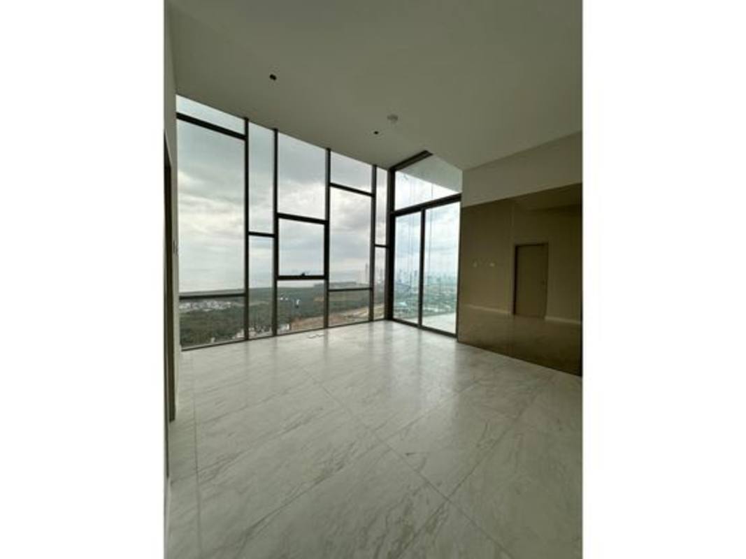Bright modern living room with panoramic floor-to-ceiling windows at PH La Maison by Fendi in Santa Maria Golf Panama