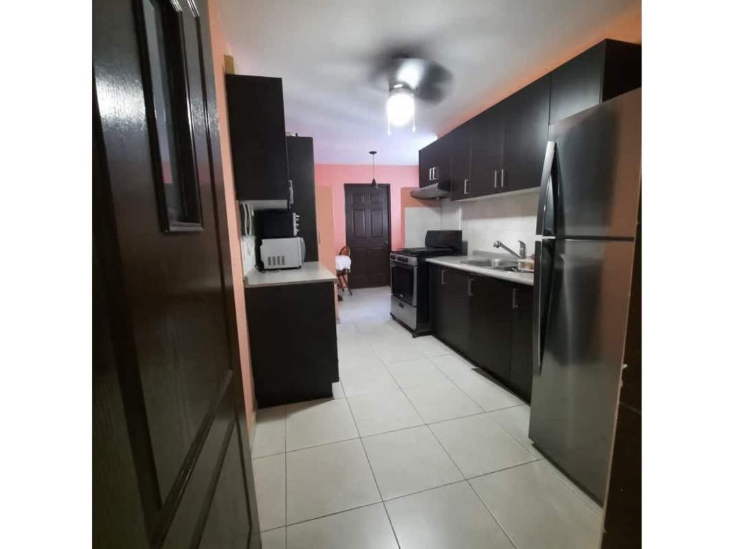 Bedroom with large window and balcony access plus ocean views at PH Aquazul Avenida Balboa Panama