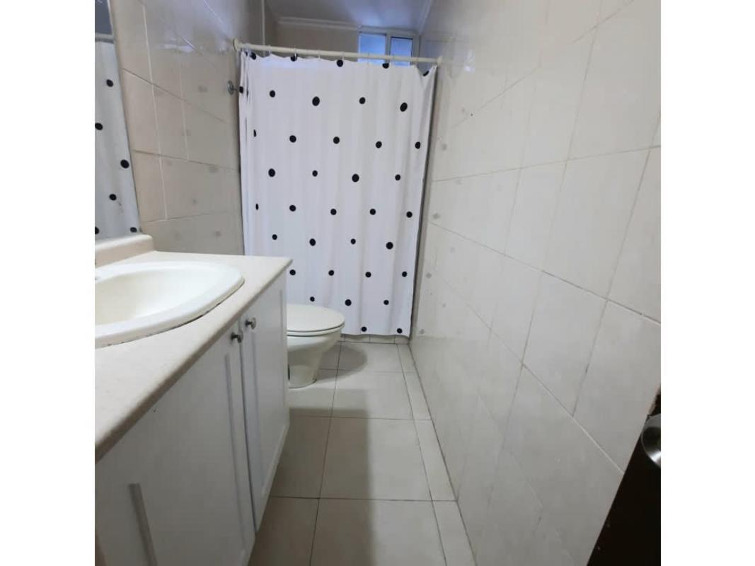 Modern bathroom with vanity and walk-in shower ceramic tiles in PH Aquazul Panama City