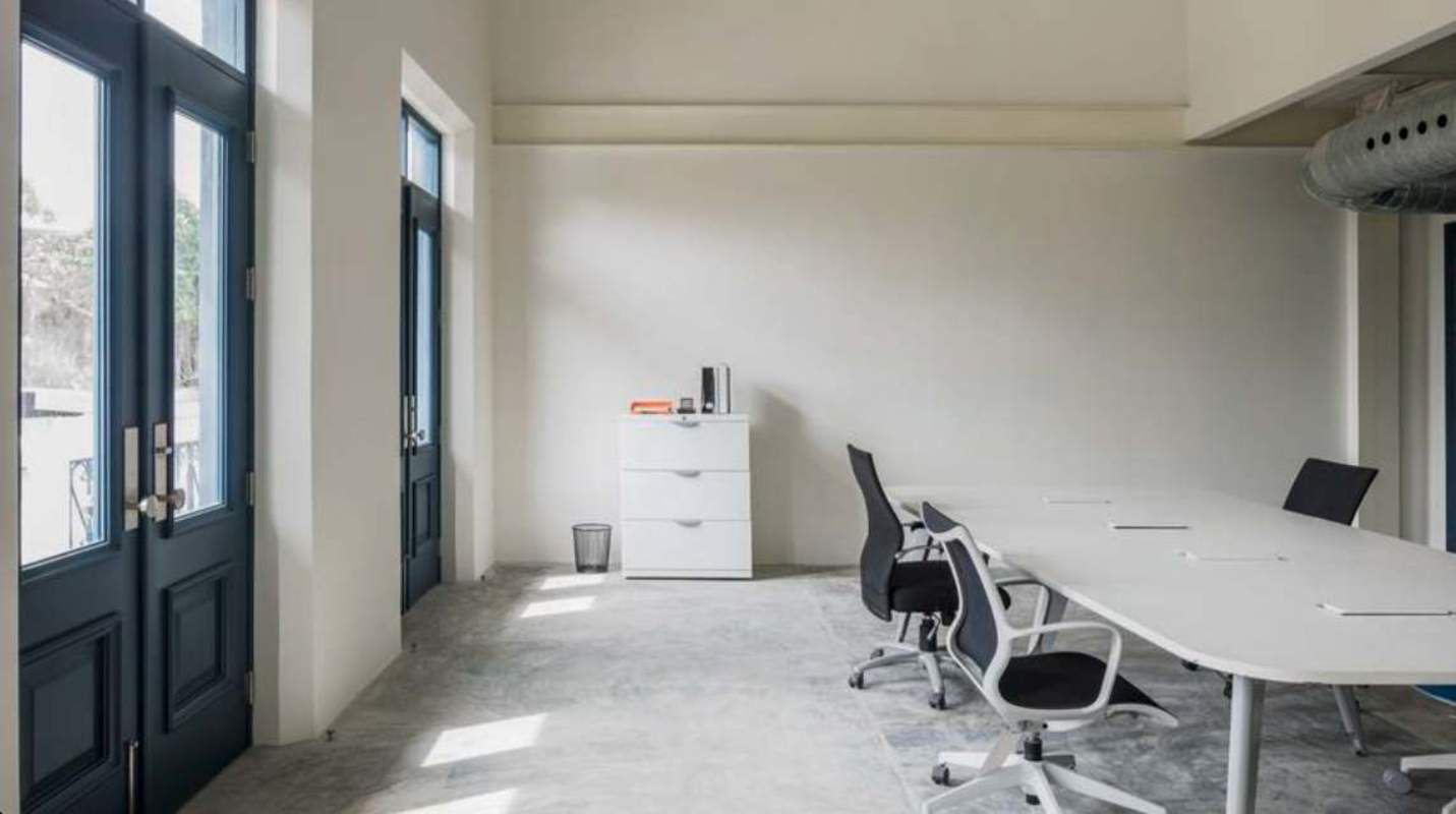 Modern conference room with large windows blue frames minimalist design in Casco Viejo Panama