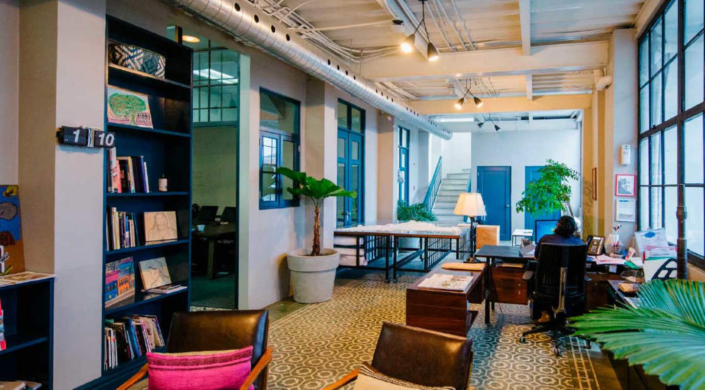 Industrial design office with exposed ducts high ceilings open concept Casco Viejo historic district Panama City
