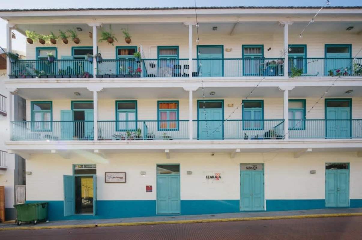 Three-story colonial style building with balconies rented commercial units Casco Viejo Panama