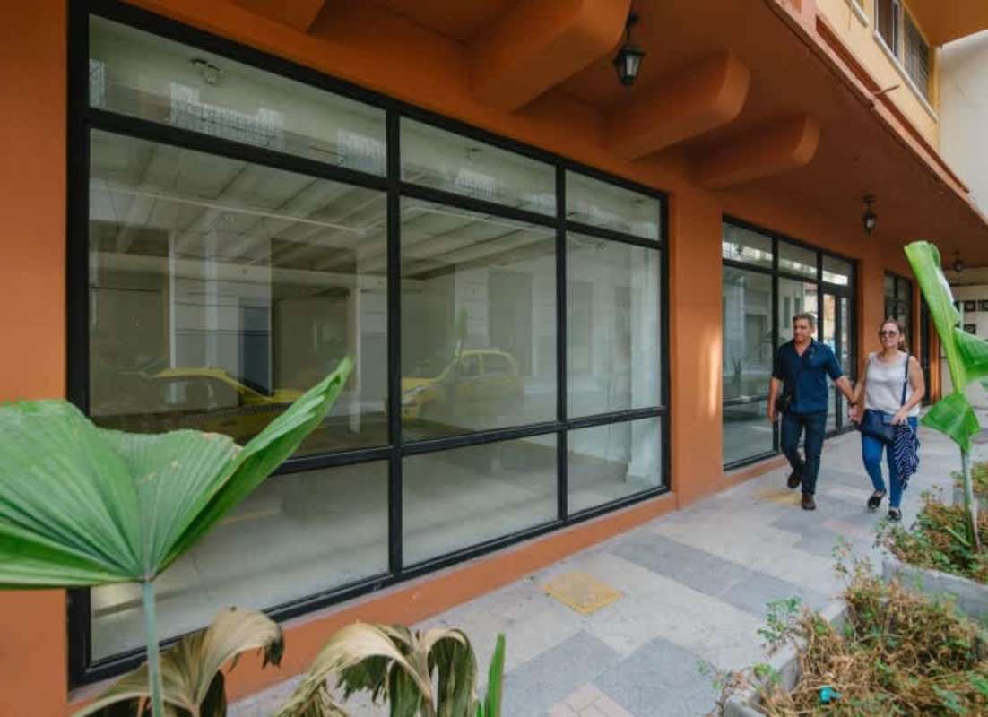 Restored art deco style commercial facade with tropical landscaping in Casco Viejo Panama