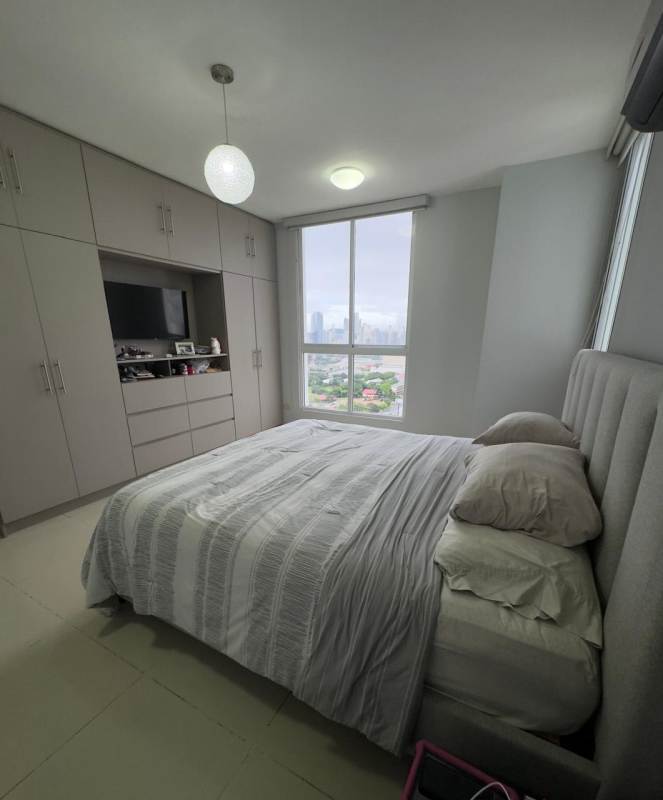 Minimalist bedroom with city view window and built-in wardrobe PH Mandarin Bay Panama