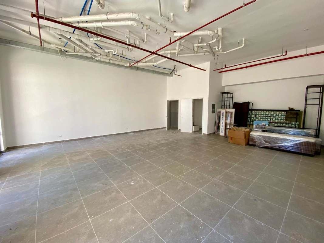 Unfinished open layout commercial unit with exposed ceiling piping tiled flooring Santa Ana Casco Viejo Panama