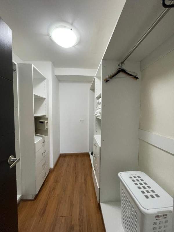 Contemporary living dining space with wooden floors, full height windows, ocean and skyline views in PH Bayfront Avenida Balboa Panama