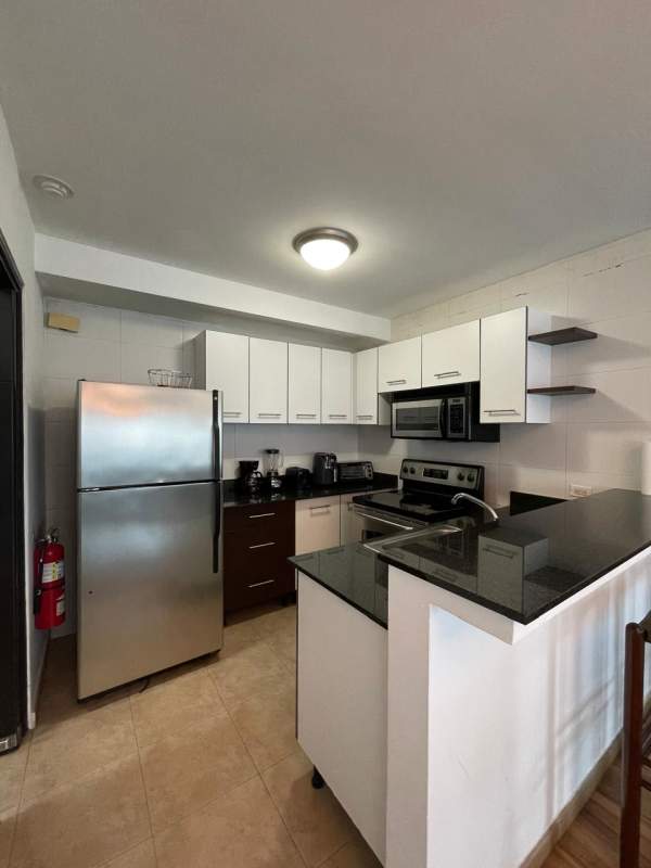 Spacious walk-in closet with shelving drawers and safe PH Bayfront Avenida Balboa Panama