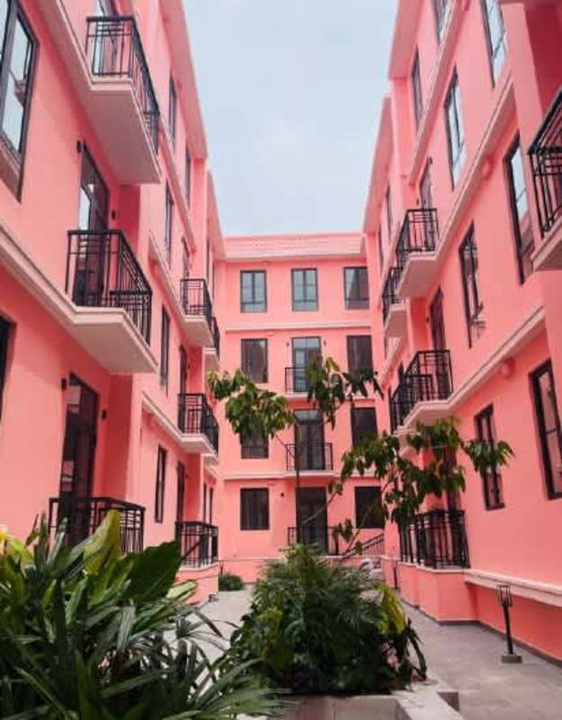 Two people enjoy rooftop panoramic views Cerro Ancón and city skyline from Casa Korsi Casco Viejo Panama