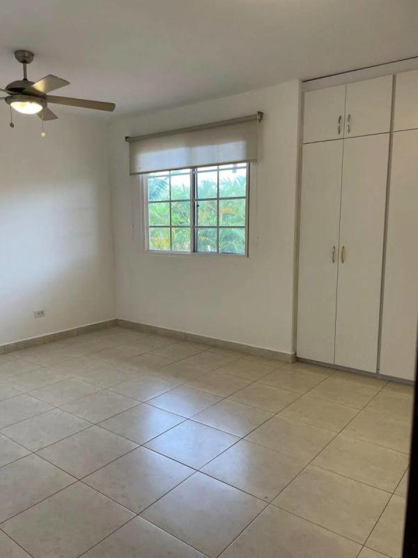 Light wood kitchen cabinets with black granite, ceiling fans and tile backsplash Villa Valencia Costa Sur