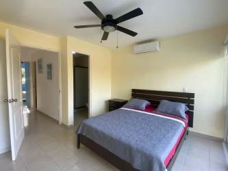 Spacious master bedroom split AC closet ceramic floors balcony doors Nueva Gorgona Panama