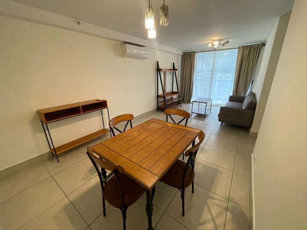 Kitchen with granite countertops, dark cabinets, appliances, large window in PH Sky Point Towers Miraflores Panama City