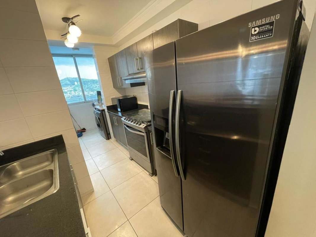 Master bedroom with AC, closet, tile floors and window view at PH Sky Point Towers Miraflores Panama