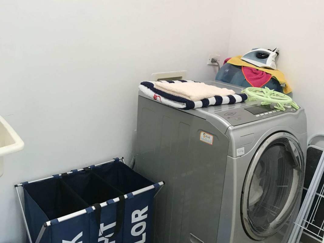 Bright furnished living and dining with floor-to-ceiling ocean view windows at Icon Tower Panama