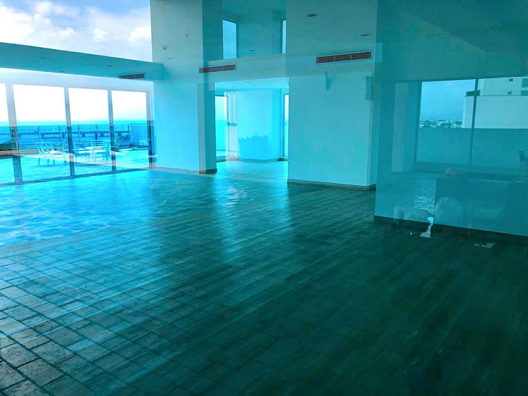 Master bedroom with ocean view balcony access at PH Icon Tower Coco del Mar