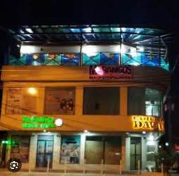 Exterior night view of Edificio Daviva's illuminated facade in Santiago Panama