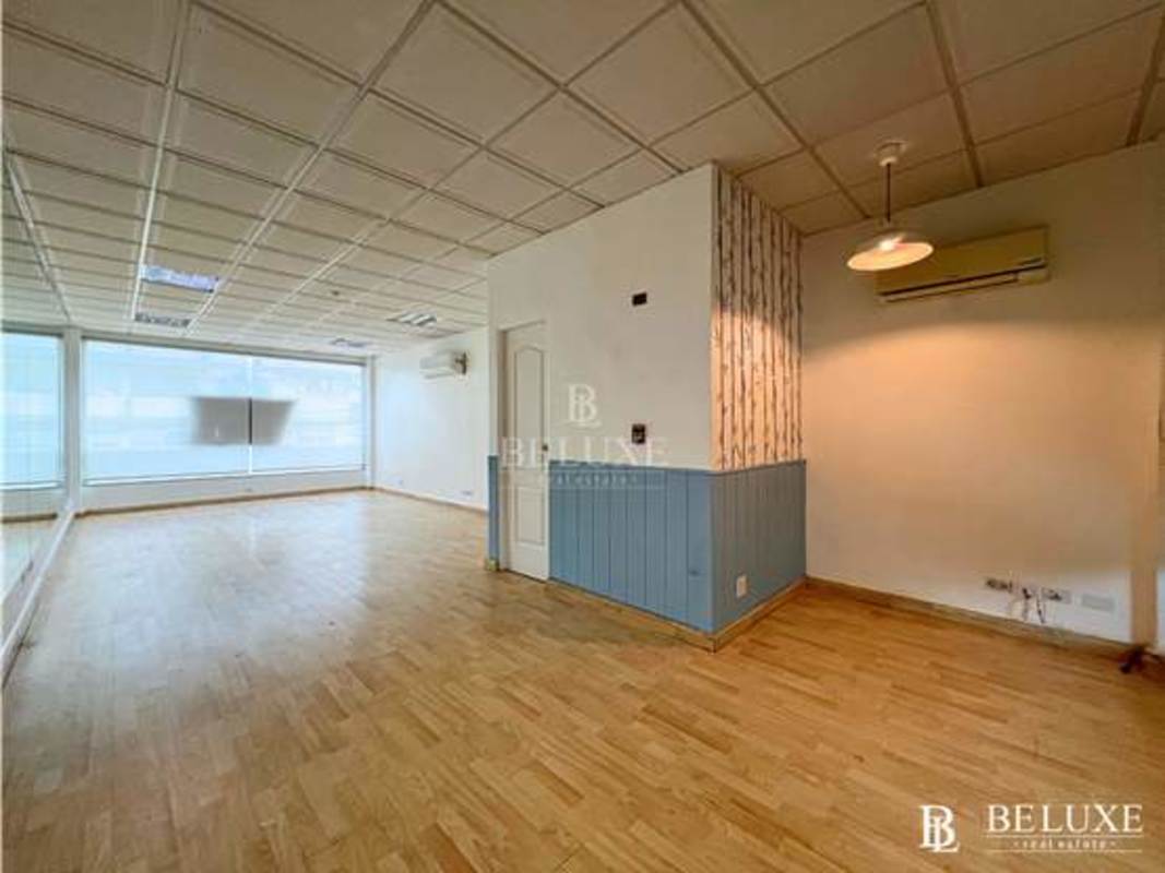 Bright interior with wood floors, large windows and partition walls in Plaza San Francisco