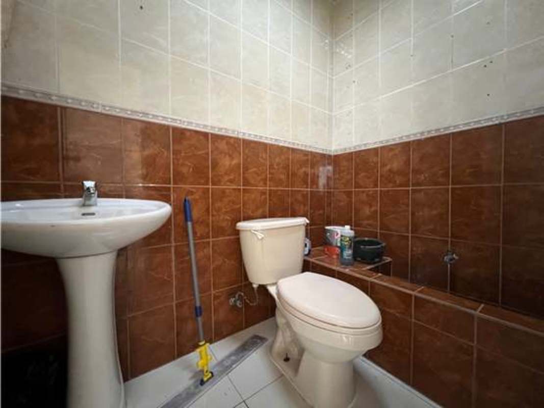 Basic bathroom with pedestal sink and toilet in commercial unit Panama