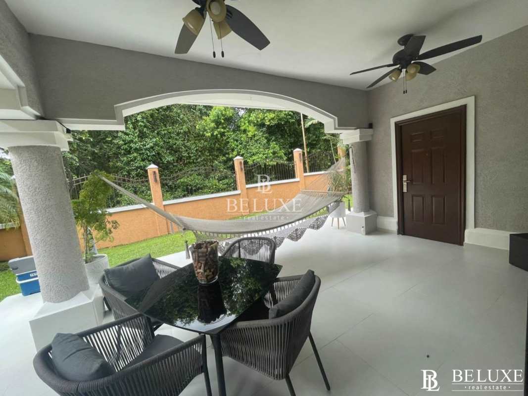 Bright living room with large windows in Clayton Village house for rent Panama